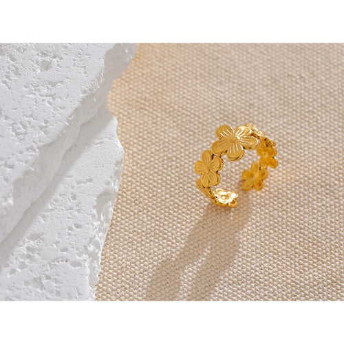 Anillo abierto ajustable con diseño floral en acero inoxidable