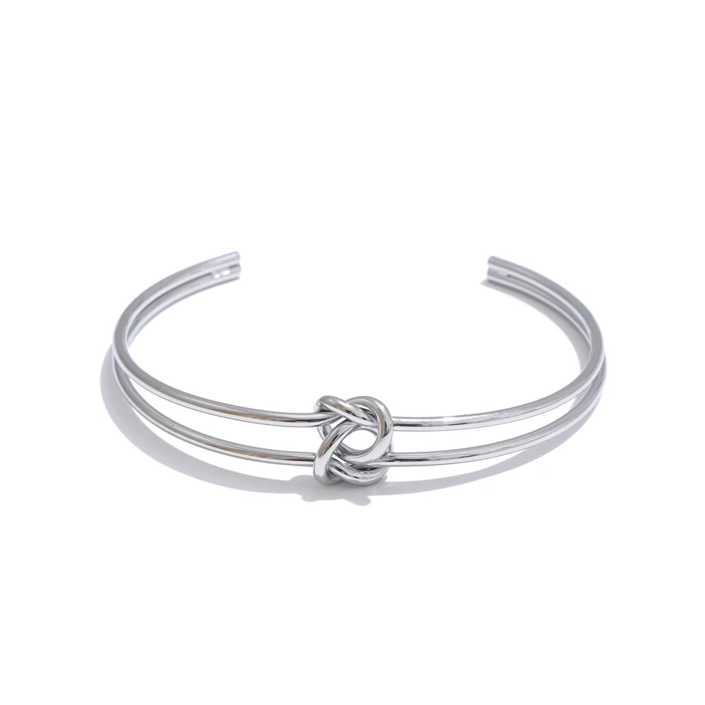 PULSERA RIGIDA CON NUDO DORADO