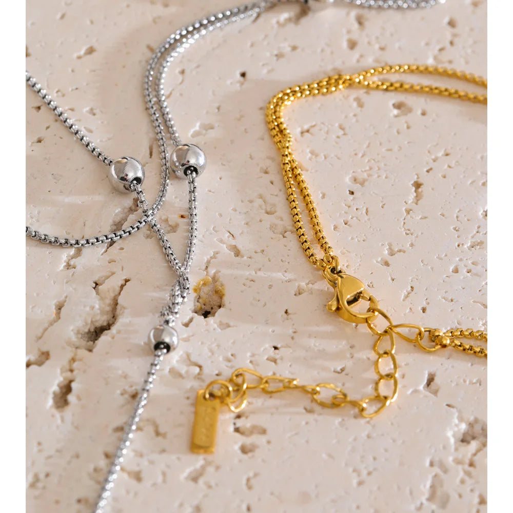 COLLAR DOBLE ASIMETRICO DORADO