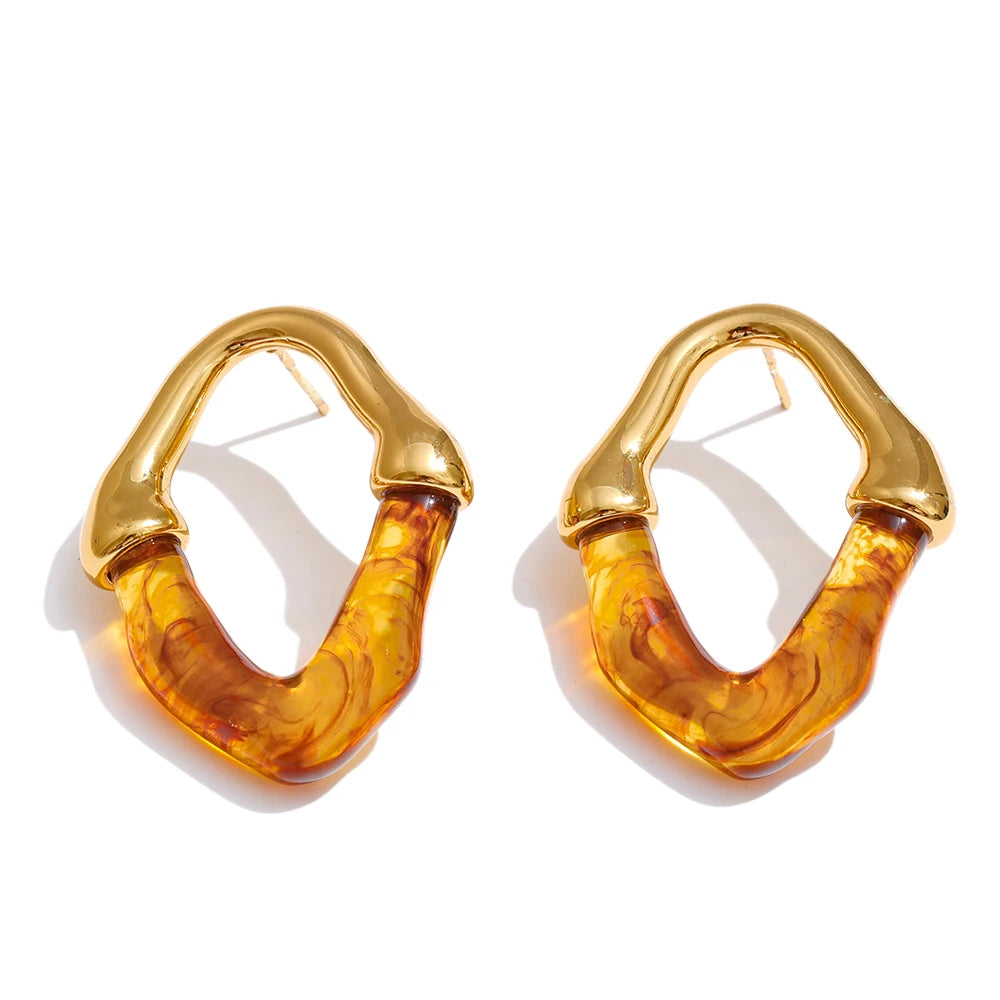 Pendientes geométricos de resina y acero inoxidable