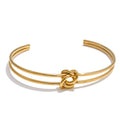 PULSERA RIGIDA CON NUDO DORADO