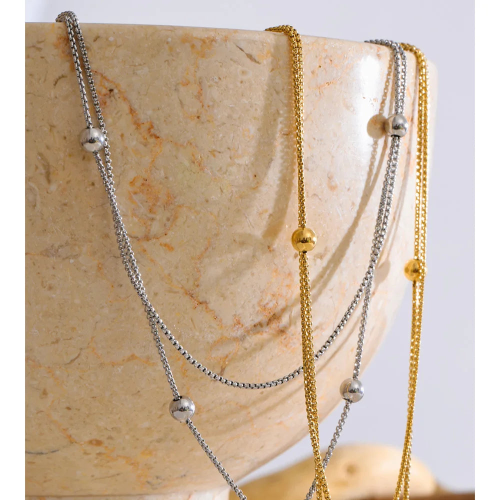 COLLAR DOBLE ASIMETRICO DORADO