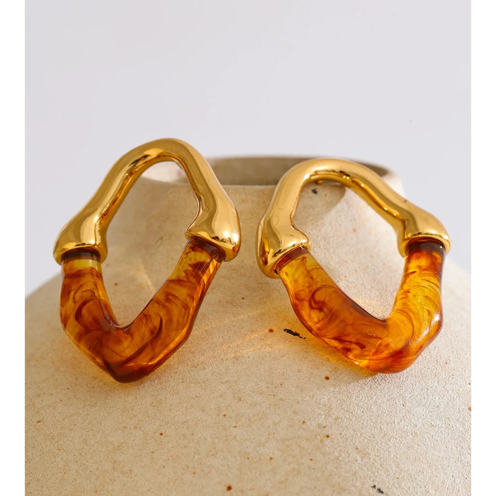 Pendientes geométricos de resina y acero inoxidable