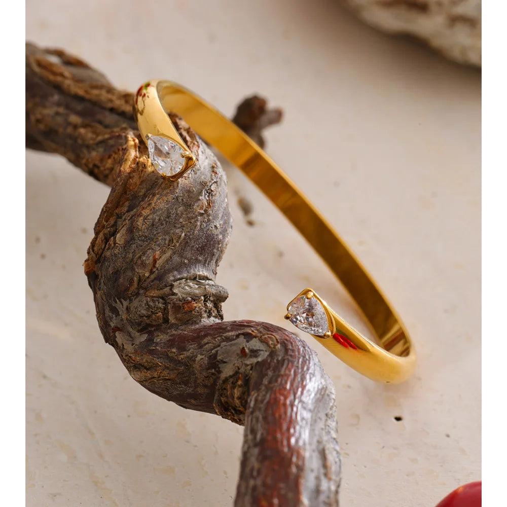 Brazalete abierto dorado con circonitas en acero inoxidable