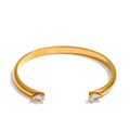 Brazalete abierto dorado con circonitas en acero inoxidable