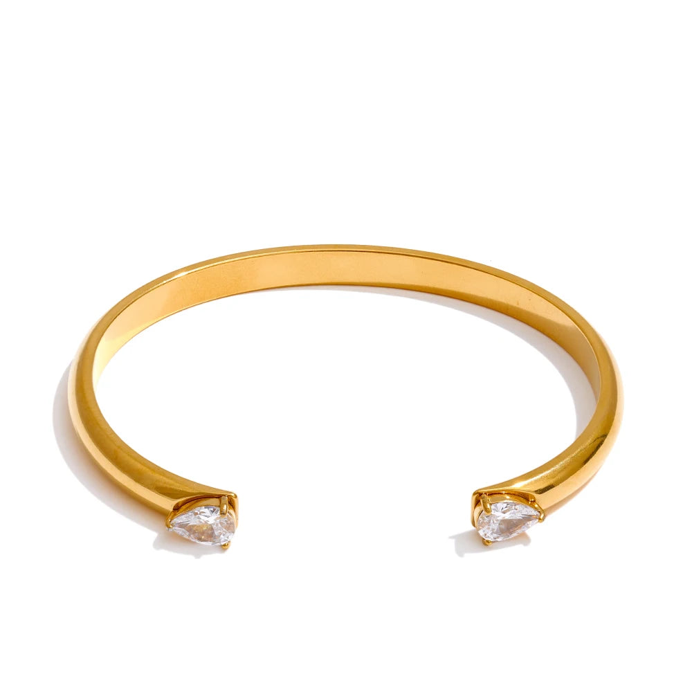 Brazalete abierto dorado con circonitas en acero inoxidable
