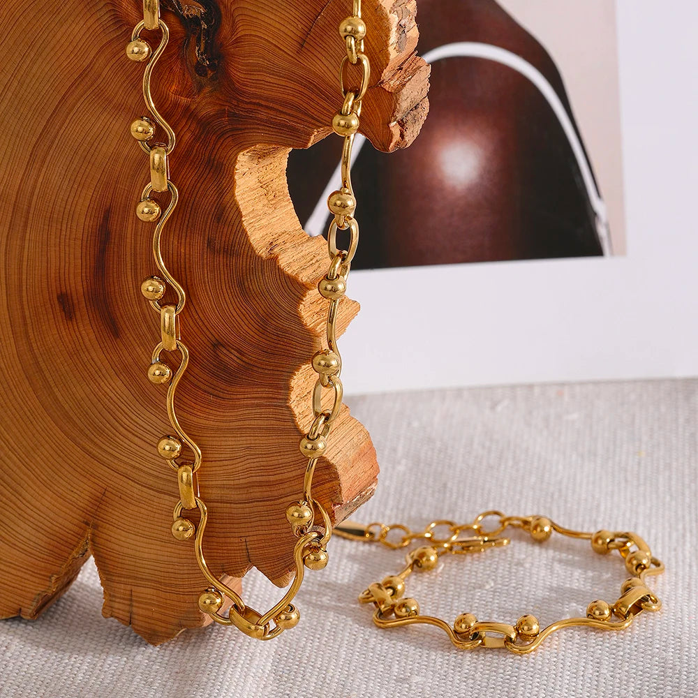 SET DE COLLAR Y PULSERA  DORADOS CON ESLABONES OVALADOS